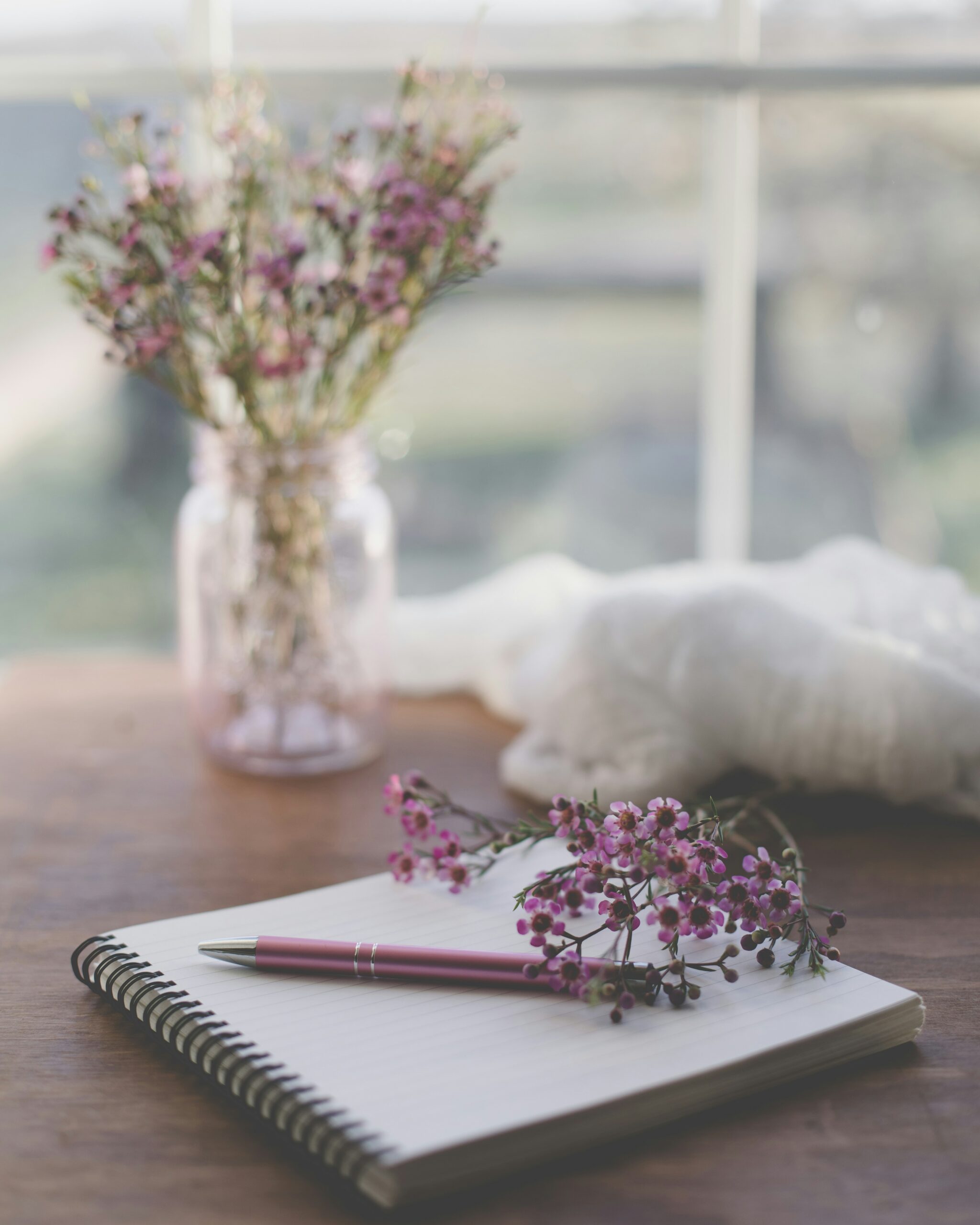 Notebook and pen with flowers